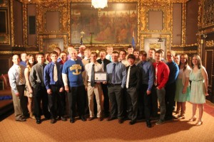 The St. Michael-Albertville Wrestling Team is honored at the Minnesota State Capitol after winning a share of the State 3A title in 2013. 