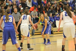 Rae Johnson of St. Michael-Albertville looks for a pass in the Section 8-4A semifinal. She led the Knights in the championship with 29 points Friday night in Collegeville.  