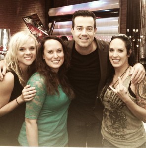 The Perkins sisters (Kat and Kelly Perkins Robinson) pose with "The Voice" host Carson Daly. 
