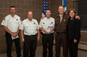 Pictured with Albertville Fire's Award-winner are Albertville Fire Chief Tate Mills, Assistant Fire Chief Jay Eull, Honoree Captain Josh Eull, Wright County Sheriff Joe Hagerty, and Mona Dohman, Commissioner, Minnesota Department of Public Safety.