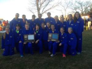 The STMA boys' and girls' cross country teams pose with their hardware. (Courtesy of the Cayo family)