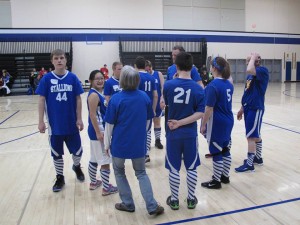 Nate Larson (44) participates in the Special Olympics basketball tournament at Rogers High last week. Nate has been accepted into a study at the University of Florida for a treatment that will help control his Tourette's Syndrome. 