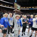 Wrestlers with trophy